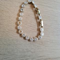 Swarovski una angelic armband goud، كما تم الإبلاغ عنه عبر iLost