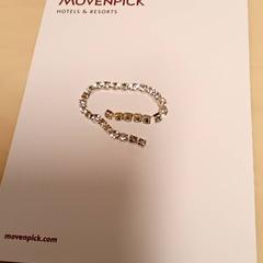 Pulseira, segundo informou Mövenpick Hotel Amsterdam City Centre usando iLost