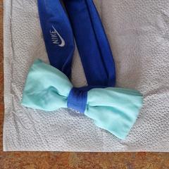 Mint groene haar strik blauwe band Nike, iLost'a bildirildiği gibi
