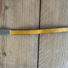 Gele leren armband met vingerafdruk, som rapportert til iLost