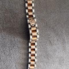 Armband met rolex logo, segundo informou a iLost