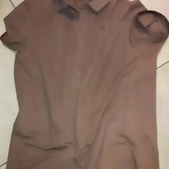 Camicia, come riportato da Leonardo Royal Hotel Amsterdam utilizzando iLost