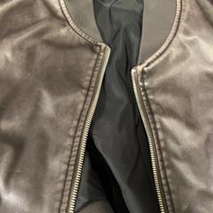 Leather coat, as reported by Dijkpop Festival using iLost